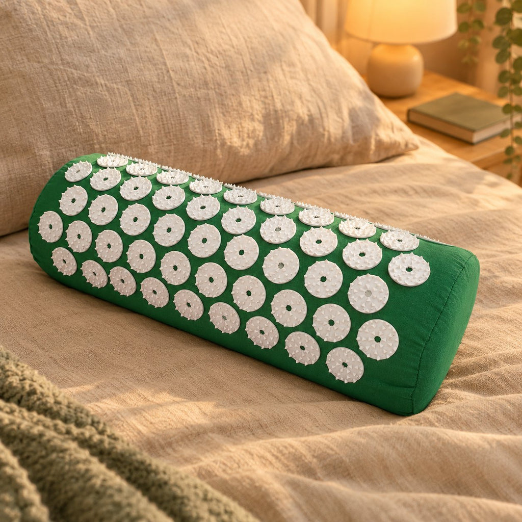 Coussin d'acupression Jade posé sur un lit